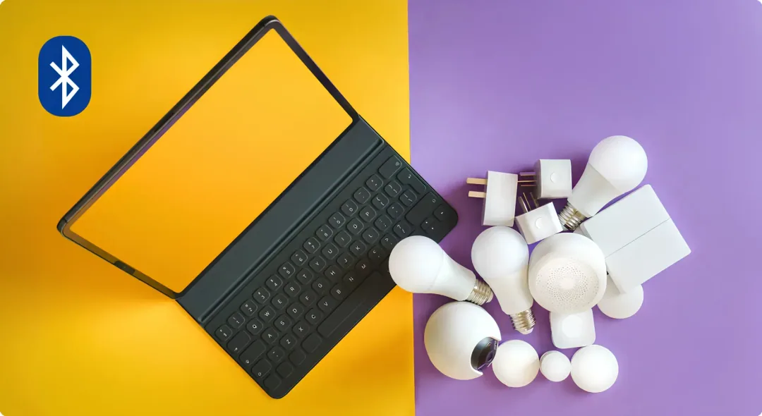 Tablet with keyboard on a light background beside smart home devices on a dark background. Includes smart bulbs and a Bluetooth logo. Modern and tech-focused.
