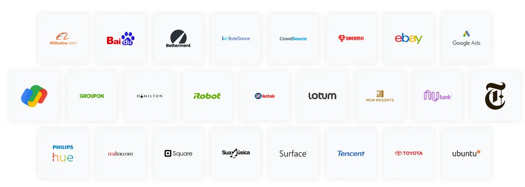 Four smartphones are arranged in an X shape on a gray surface, each displaying logos of popular programming frameworks: React, Flutter, Xamarin, and Kotlin.